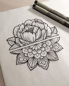 a drawing of a flower on paper with markers