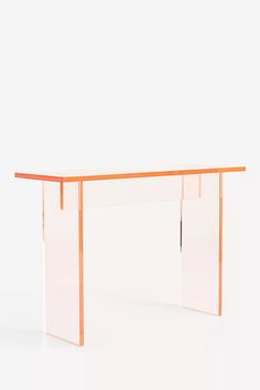 an orange and clear console table against a white background with no one around it,