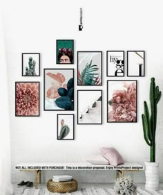 a white bathroom with pictures on the wall and cactus in vases next to it