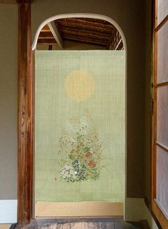 an open doorway with a painting on the wall