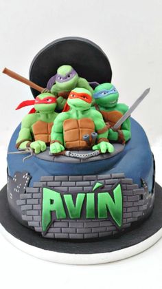 a teenage mutant birthday cake with ninja turtles on top