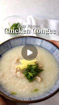 someone holding a bowl of chicken congee