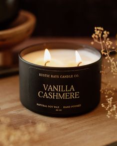 vanilla cashmere scented candle sitting on top of a wooden table