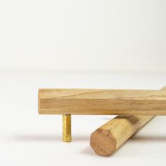 two pieces of wood sitting on top of each other