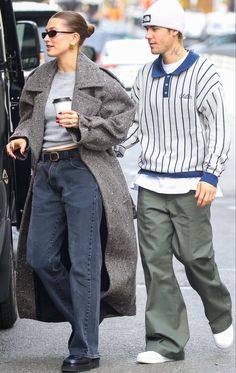 a man and woman walking down the street