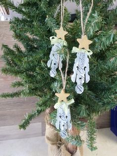 an ornament hanging from a christmas tree in a sack with twinklings