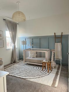 a baby's room is decorated in neutral colors