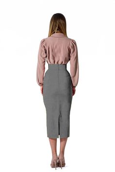 This midi skirt is crafted from high-quality grey cotton, with a soft feel and timeless style. The skirt is lightweight and features an elastic waistband for a comfortable fit. Perfect for formal and casual looks. Product Features Please Compare your Measurements To our Size Chart Before Purchase Fully Lined Fitted waist Center back seam with invisible zipper Regular fit- true to size Skirt Length is 30 Inches from Waist Hand Wash with mild soap. Fabric is a 100% Cotton Crepe Delivery Time This Gray High Waist Skirt For Work, Elegant Cotton Midi Skirt, Gray Lined Pencil Skirt Bottoms, Gray Long Skirt For Workwear, Gray Long Skirt For Work, Gray Lined Skirt For Work, Fitted Gray Skirt With Pockets, Gray Knee-length Workwear Bottoms, Gray Fitted Skirt With Pockets