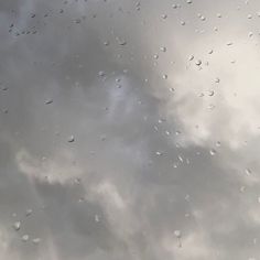 rain drops on the window and sky in the background