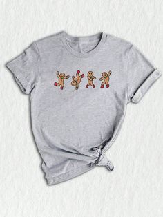 Introducing our Gingerbread Man Dancing Shirt, a humorous and festive addition to your Christmas wardrobe. This Funny Christmas Shirt showcases a playful baker-themed design, making it a perfect choice for those who appreciate the joy of baking during the holiday season.Gingerbread Man Dancing Shirt, Funny Christmas Shirt, Funny Baker Tee, Christmas T-Shirt, Holiday Shirt, Christmas Cookies Tee Athletic Heather Casual  Short Sleeve  Animal,Cartoon,Christmas,Colorblock,Figure,Geometric,Graphic,Le Man Dancing, Joy Of Baking, Christmas Wardrobe, Christmas Shirt Funny, Cartoon Christmas, Dance Shirts, Animal Cartoon, Geometric Graphic