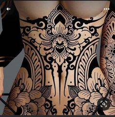 the back of a woman's body with tattoos on it