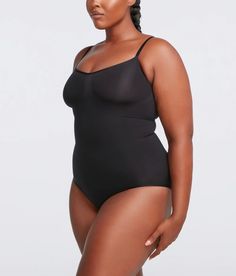 Discover the ultimate in comfort and confidence with our Curvy Perfect Smoothing Bodysuit Shaper. Crafted for all-day wear, this shapewear is designed with whisper-light material and a seamless, smooth fit to reduce bulges and enhance your natural silhouette. Say goodbye to discomfort and hello to a sleeker you! Shop now for the most comfortable shapewear you'll ever wear. Product Details: Material: 77% Nylon + 23% Spandex Convenience: Eye and hook closure for easy bathroom access Custom Fit: Ad Shapewear Plus Size, Plus Size Shapewear, Model Shots, Plunge Bodysuit, Full Body Shaper, Full Body Suit, Suits For Sale, Leggings Sale, Sleek Look