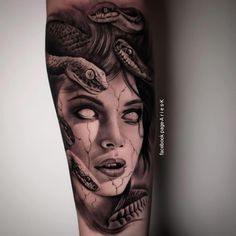 a woman's face with snakes on her arm