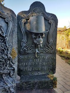 a grave with a skull wearing a hat