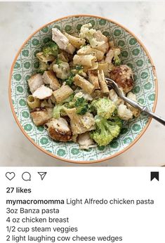 a bowl filled with chicken and broccoli on top of a table next to a fork