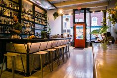 a bar with lots of bottles on the shelves