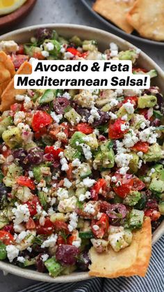 a bowl filled with salad and tortilla chips