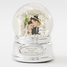 a snow globe with an image of a bride and groom