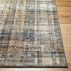 an area rug is shown on the floor with wood floors and hardwooding in the background