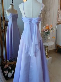 Step into a world of magic and elegance with this stunning Vintage Purple Satin Fairy Dress. The luxurious satin fabric in a dreamy purple hue drapes beautifully, exuding timeless charm and sophistication. The spaghetti straps add a touch of delicate femininity, making it perfect for any enchanting occasion. The highlight of this gown is the whimsical back wings design, adding a fairy-tale-like allure.   Garment Size   	 		 			Size 			XS 			S 			M 			L 			XL 			2XL 		 		 			Bust 			76 			80 			8 Strapless Lavender Dress, Simple Long Purple Dress, Pastel Purple Formal Dress, Periwinkle Dress Aesthetic, Dress Bodice Styles, Vintage Formal Dresses 1950s, Empire Waistline Dress, Draped Back Dress, Silk Ruffle Dress