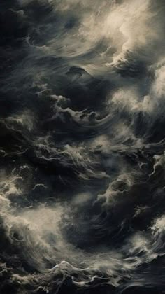 an image of some very dark clouds in the sky with white and black colors on it