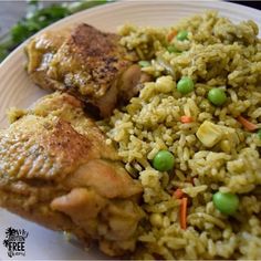 a white plate topped with rice and meat