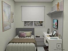 a small bedroom with a bed, desk and computer