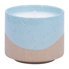 a candle that is sitting in front of a white background