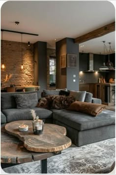 a living room filled with furniture next to a brick wall