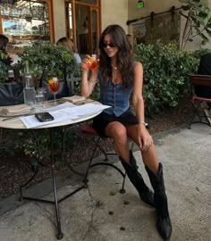 Cowboy boots, denim vest, black mini skirt, long hair, European Cafe Fest Outfits, Miniskirt Outfits, Winter Trends, Festival Looks, Vest Outfits