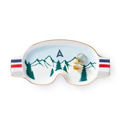 a pair of glasses with mountains and trees painted on it