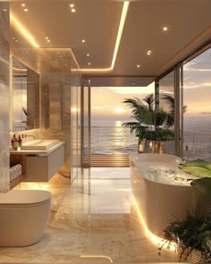 a bathroom with a large bathtub next to the ocean