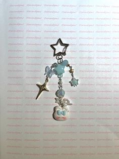 a necklace with charms and stars hanging from it