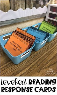 three blue trays filled with reading response cards