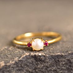 Fresh Water Pearl And Ruby Dainty Wedding Ring Handmade Statement Ring June Birthstone Round Shaped Ring Gifts For Her White Gemstone Ring Welcome to Rockstiffart Experience stunning jewelry which compliments your style everyday, All the items in my shop are hand made items and are crafted by our Master Goldsmith in our workshop, We pay a lot of emphasis on the making of the ring and we always assure you that we will provide best quality products every time toy you, Detailed description of the p Elegant Gold Three Stone Crystal Ring, Elegant Gold Three-stone Crystal Ring, Elegant Wedding Rings With Gemstone Accents, Adjustable Ruby Rings For Wedding, Adjustable Ruby Ring With Birthstone For Wedding, Delicate Three Stone Jewelry For Wedding, Adjustable Ruby Wedding Ring, Adjustable Ruby Birthstone Ring For Wedding, Delicate Three-stone Wedding Jewelry