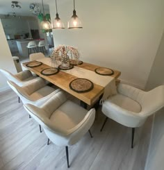 a dining room table with six chairs around it