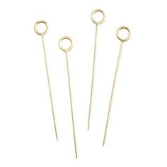 three pairs of gold - plated metal hair pins with rings on them, one is round and the other two are circular