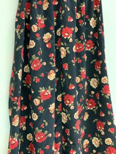 Vintage black floral skirt Approximate Size: 13 W; 33 L Black Floral Print Skirt For Summer, Black Floral Print Maxi Skirt For Spring, Black Floral Print Skirt, Summer Black Maxi Skirt With Floral Print, Black Skirted Bottoms With Floral Print, Chic Black Floral Print Maxi Skirt, Black Floral Print Flowy Skirt, Black Flowy Floral Skirt, Black Floral Print Mini Skirt