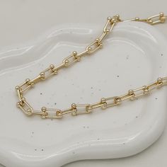 The Ryker Necklace, a timeless piece, embodies luxury and sophistication. Crafted from 18K gold filled materials, this 8mm bead link chain features a lustrous finish and a versatile 18-inch length with a 2" extender. Its refined elegance makes it a must-have for those who appreciate quality craftsmanship and style. Perfect for any occasion, it's sure to make a statement. 18" with 2" extension 18k gold filled demi-fine Luxury Tarnish Resistant Chain Link Necklace, Gold Chain Link Necklace For Everyday Luxury, Timeless Gold-plated Cable Chain Necklace, Modern Gold Chain Necklace For Everyday Luxury, Timeless Gold Chain Necklaces For Everyday Luxury, Classic Gold-plated Necklace With Chunky Chain, Luxury Link Chain Necklace Tarnish Resistant, Modern Everyday Luxury Gold Chain Necklaces, Elegant Gold-tone Cable Chain Necklace