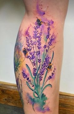 a woman's leg with purple flowers and bees painted on the side by watercolor pencils