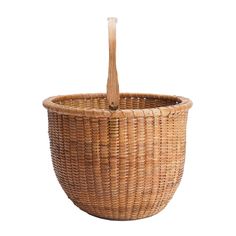 a wicker basket with a wooden handle