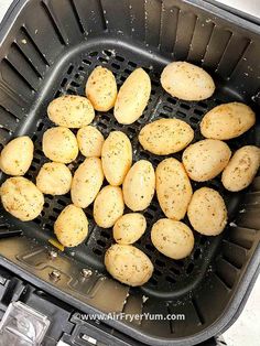 potatoes in an air fryer being cooked