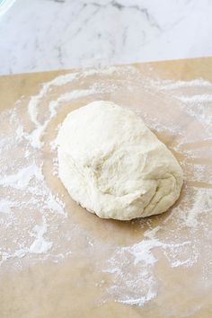 a ball of dough sitting on top of a table