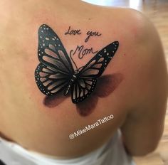 a woman's back with a butterfly tattoo that says, i love you mom