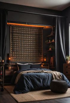 a bedroom with black walls and blue bedding