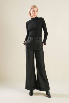 A woven pant with flare leg Details: Self: 97% Polyester 3% Spandex Size & Fit - Model is 5`8" And Wearing Size Small- Measurements Taken From Size Small- Approx. Length: 42" Inseam- 30" Elegant Black High-waisted Flare Pants, Elegant Black High-waisted Flares, Elegant Black Flares For Night Out, Black Flare Wide Leg Pants, Chic Black Flare Trousers, Black Wide-leg Flares For Workwear, Black Flare Wide Leg Pants For Business Casual, Black Flared Wide Leg Pants For Formal Occasions, Black Flare Bottoms For Business Casual