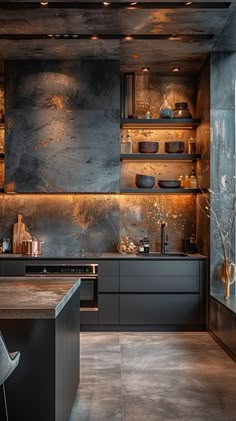 a modern kitchen with black cabinets and gold foiled backsplashing on the walls