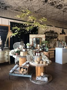 a room filled with lots of different types of furniture and flowers on top of it