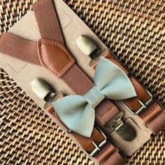 Sage Bow Tie & Brown Suspenders are PERFECT for a sage green wedding, bowtie, ring bearer outfit, boho wedding, bow ties for men or any other special occasion!Want to be 100% certain about the color? Simply order a color swatch and we will get one in the mail for you! Click here: https://theboldbowtie.com/search?q=swatch**Care Instructions**~Spot clean with warm water~Not intended for sleep~Do not leave young children unattended while wearing our products- small parts could become a choking haza Bow Tie And Suspenders Set For Father's Day Party, Elegant Adjustable Belts And Suspenders For Wedding, Adjustable Bow Tie For Groom, Summer, Adjustable Summer Bow Tie For Groom, Adjustable Summer Bow Tie For Grooms, Classic Wedding Belts And Suspenders With Bow Tie, Adjustable Dapper Belts And Suspenders For Party, Elegant Belts And Suspenders As Gift, Summer Wedding Bow Tie For Groom