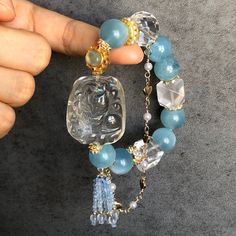 Clear Quartz with Rainbow Hand Carved Nine-tailed Fox Pendant Charm with Aquamarine & Rose Quartz Crystal Bead Bracelet | Removable Tassel | Love & Communication | Custom Made | Personalized Gift | F12 📏Size 👉Bead Size: 13.4-15.4mm, Wrist Length: 15.5cm, Fox Pendant: 33 x 27.2 x 14.2mm 🌈 The Clear Quartz carved nine-tailed fox charm is adorable, but what makes it even more special is that it contains a rainbow!  🌊Aquamarine focuses energy through the throat and heart chakra, aiding in heart